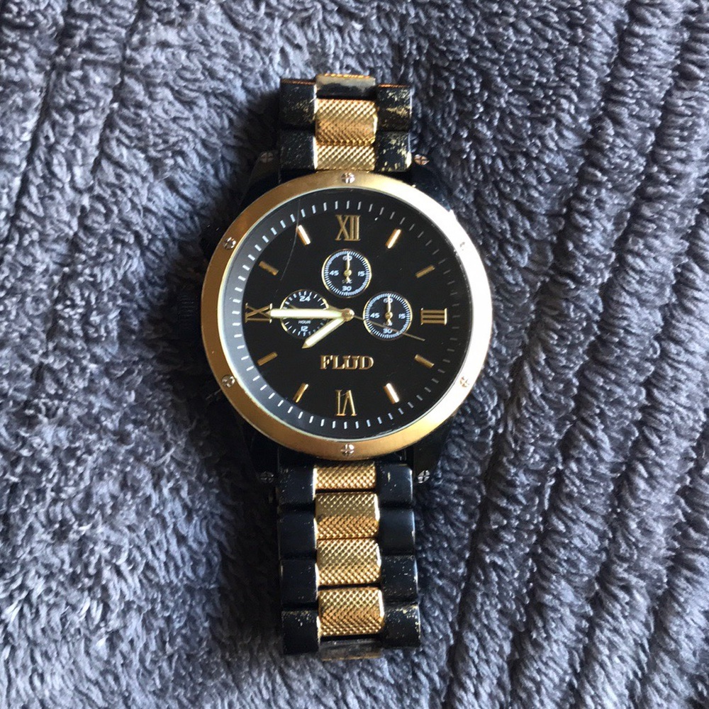 Black and gold Flud watch